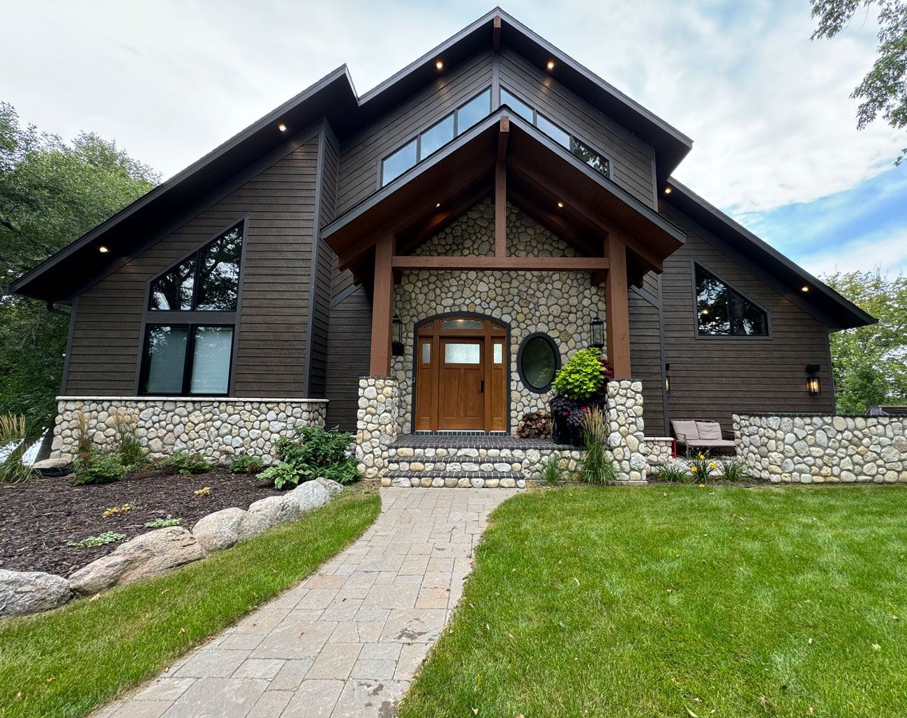 A large house with a brick walkway leading to it