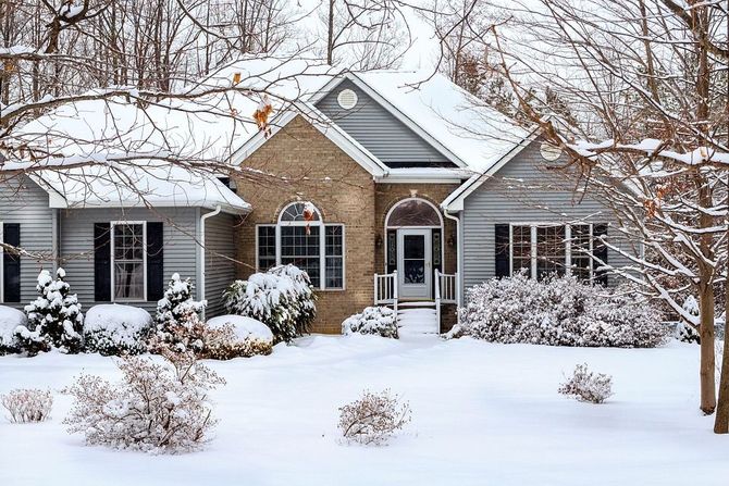 A beautiful suburban home covered in a fresh layer of winter snow.