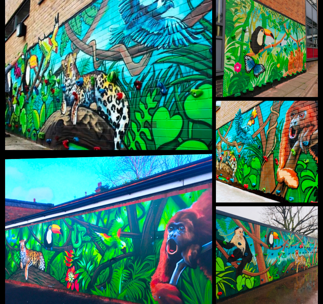 Jungle mural: jaguars, toucans, monkeys, lush green foliage, vibrant colors, on a brick building exterior.