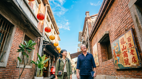 A teacher with a student having a cultural tour in Taiwan