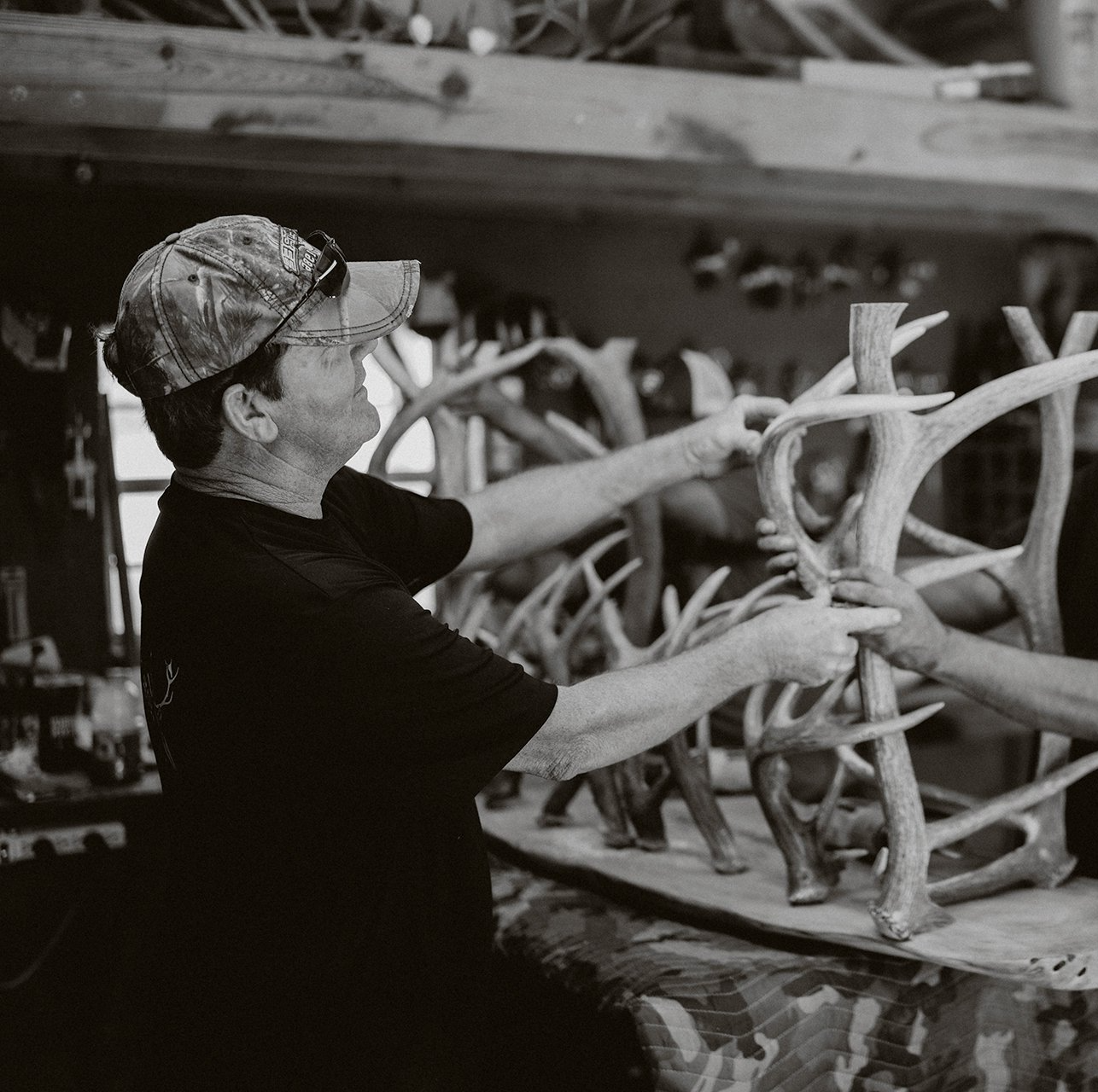 Terry Wilson inspecting a piece of antler furniture