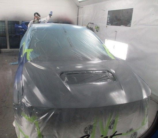 A car is being painted in a paint booth. Auto Body Repair in Colville, WA