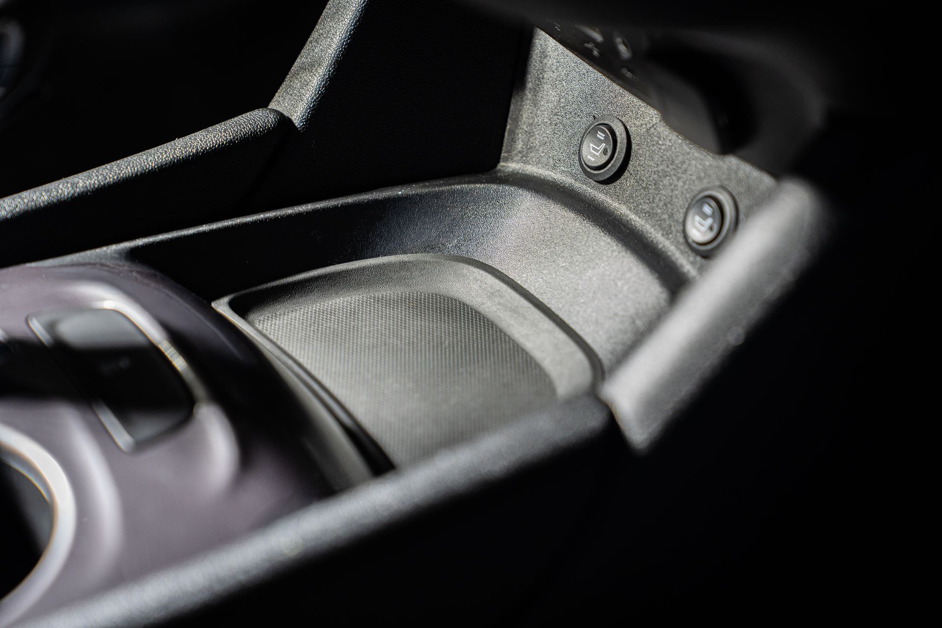 Close-up of a black and gray camera lens and body with metal screws