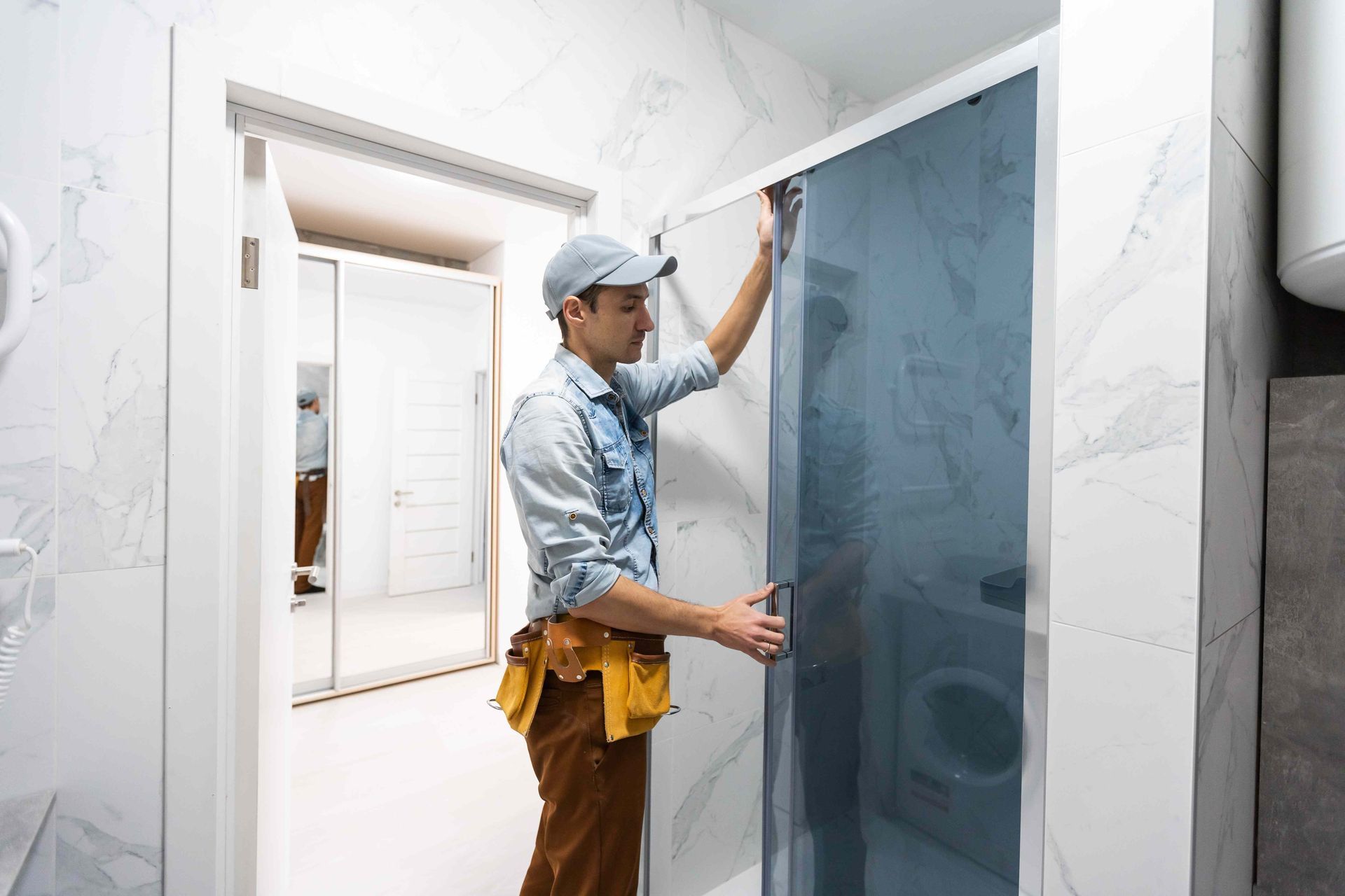Man installing bathroom door