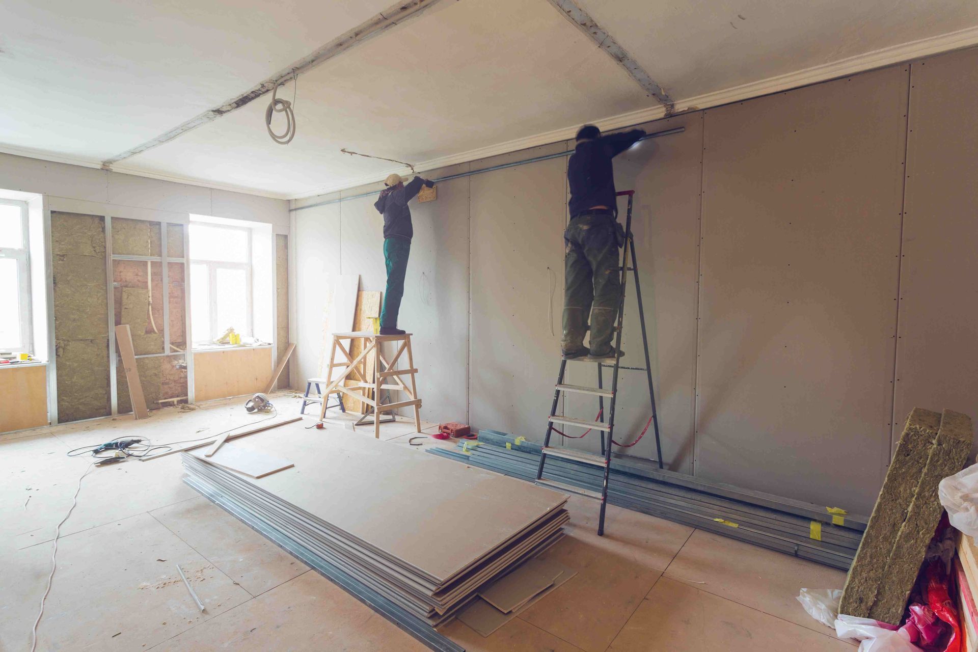 Men installing drywall