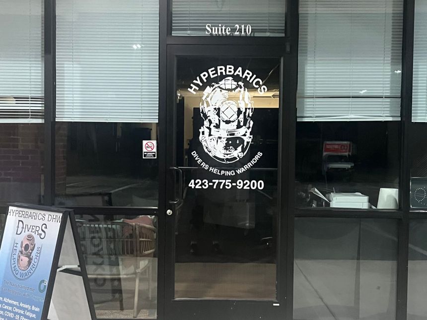 Storefront of Hyperbaric clinic with glass door, logo, and phone number 423-775-9200.