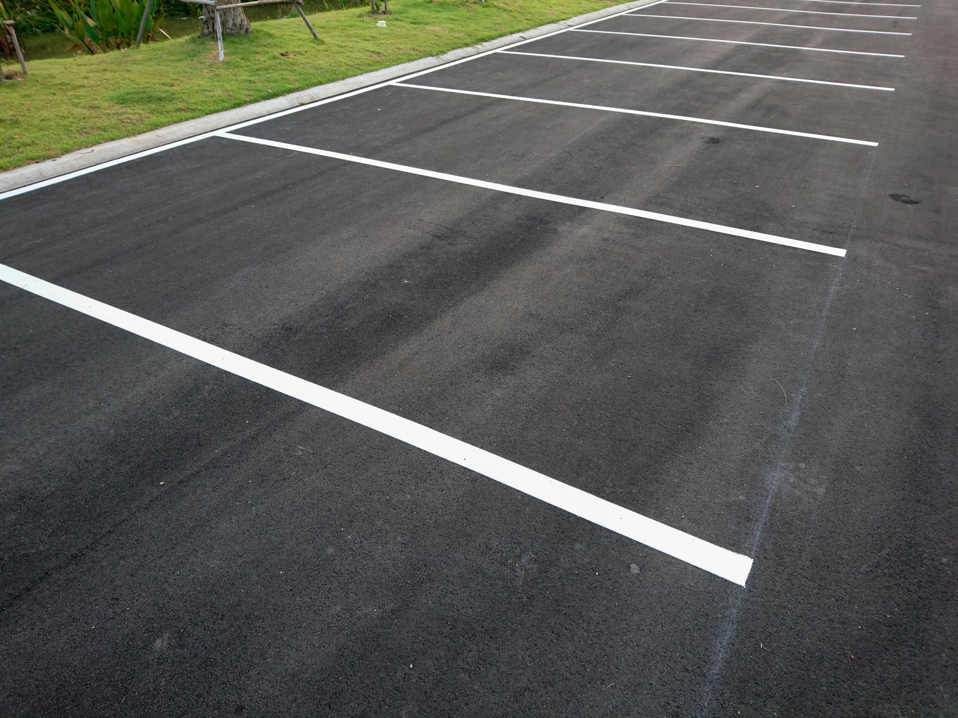A parking lot with white marking line.
