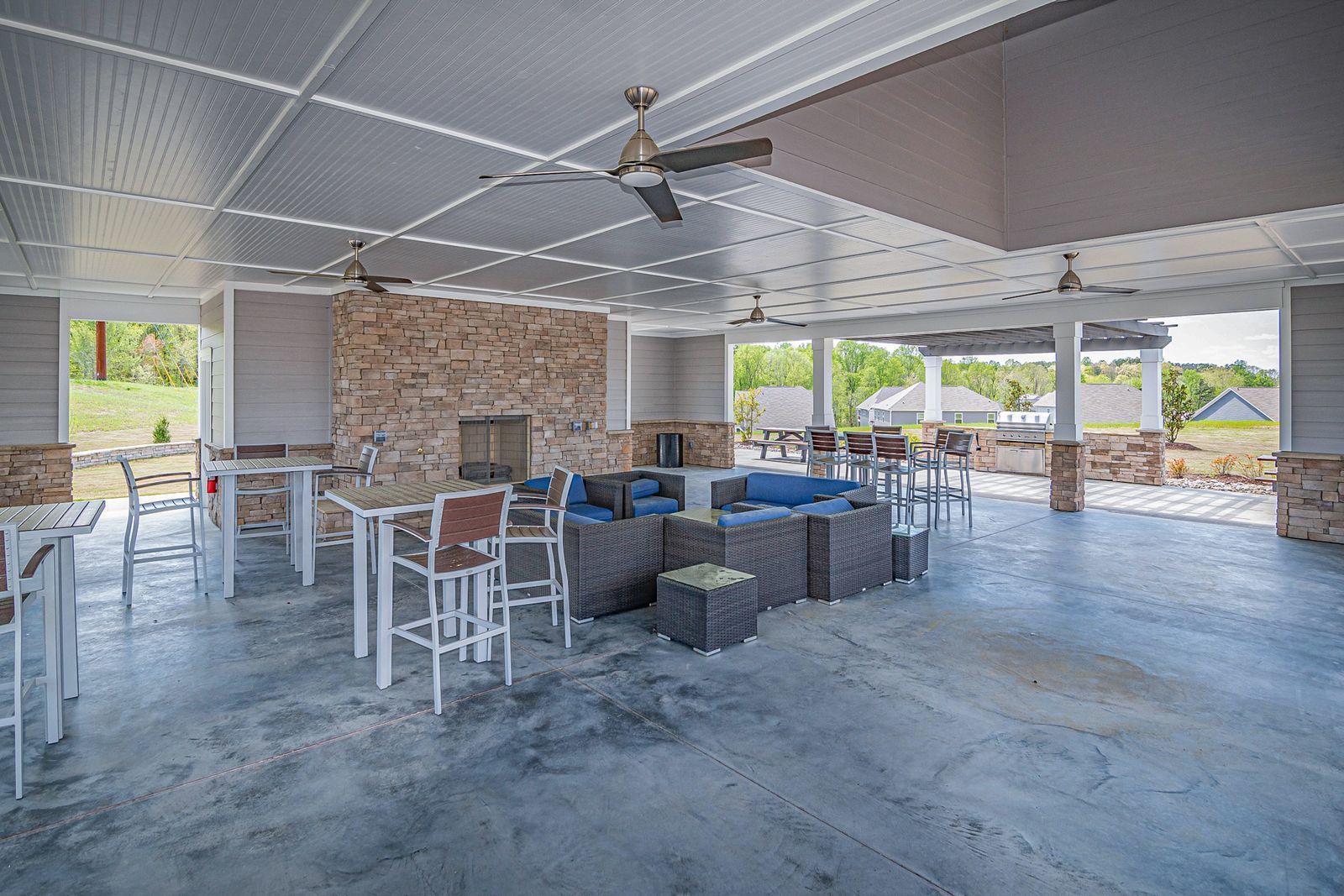 Covered patio with a smooth gray coated concrete floor