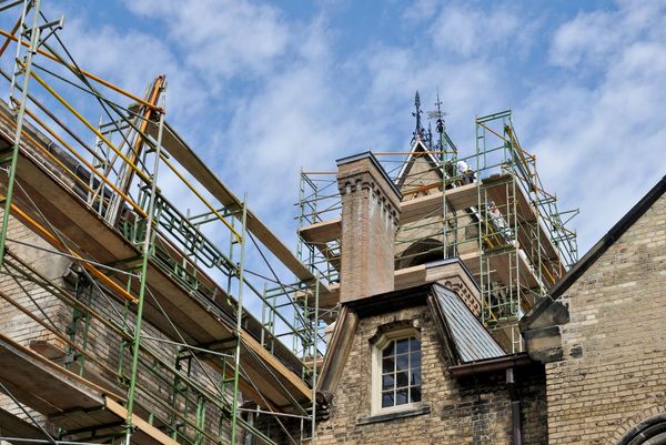 A building under construction with scaffolding around it
