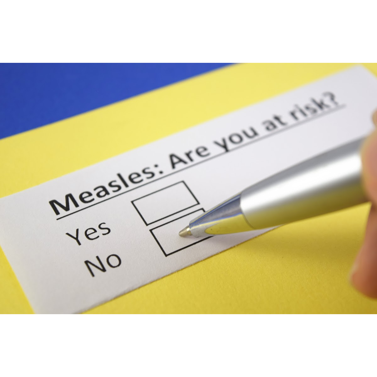 Hand holding pen, filling in