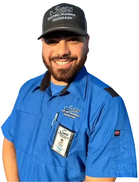 A man with a beard wearing a blue shirt and a black hat