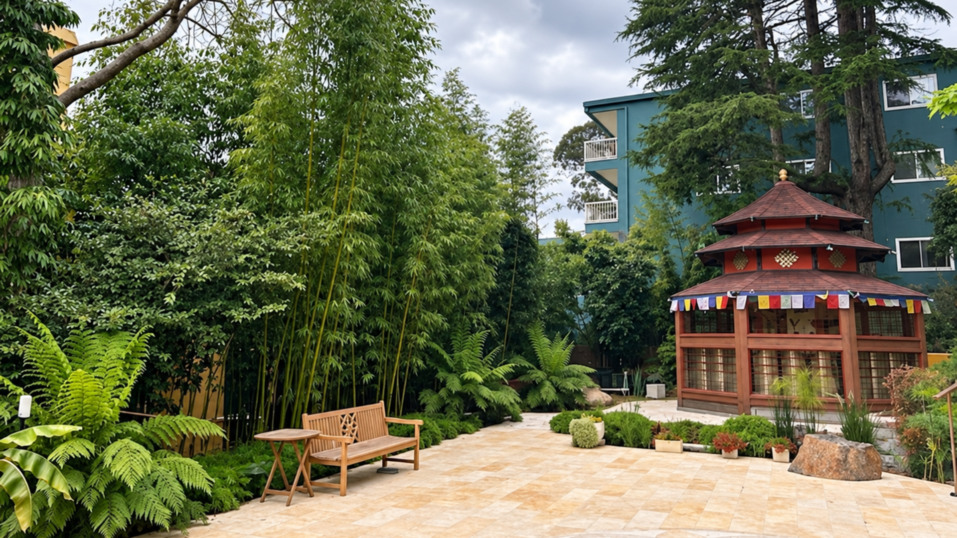 Garden patio with stone path, benches, lush greenery, and a red gazebo in front of a blue house