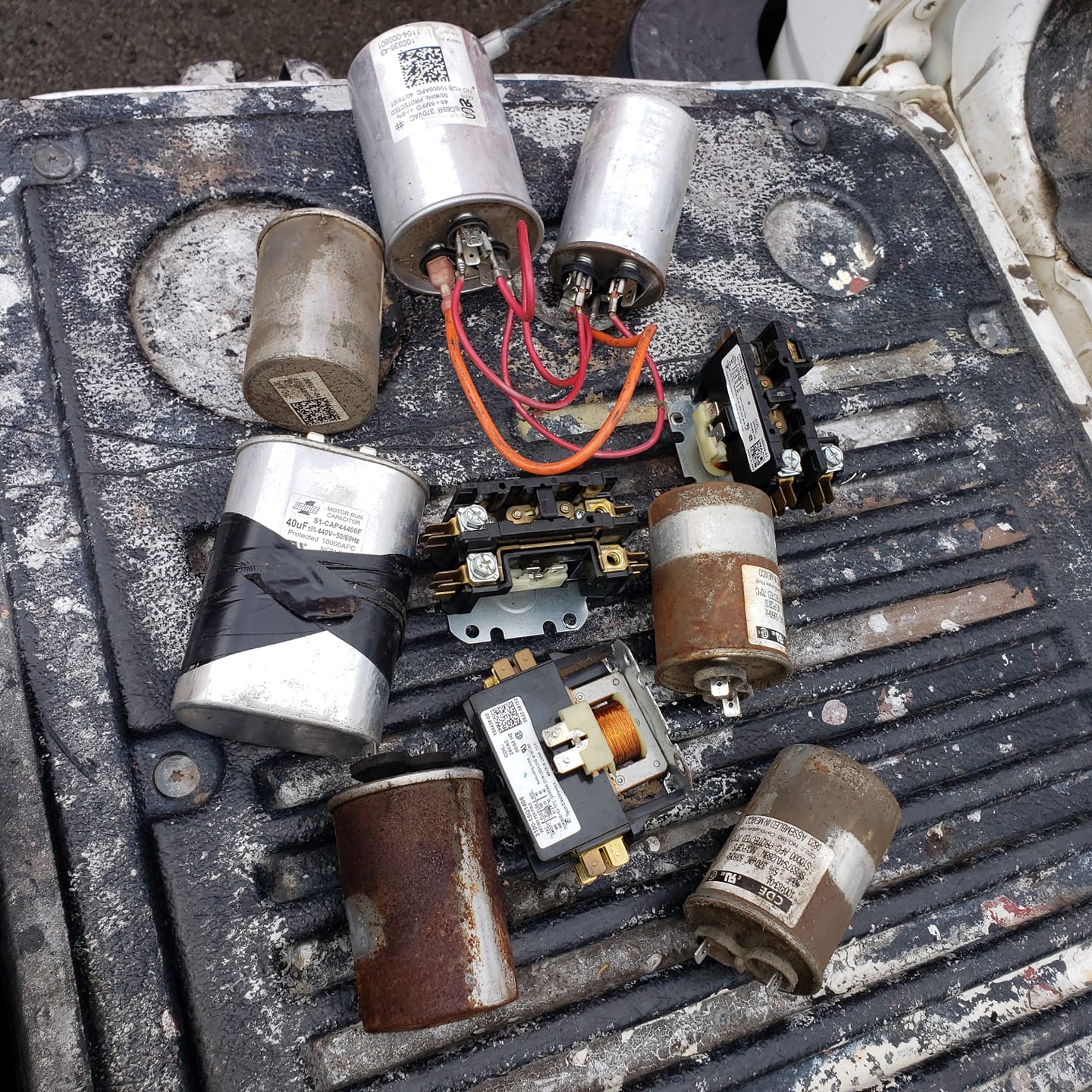 A bunch of electrical components laying on top of a truck bed