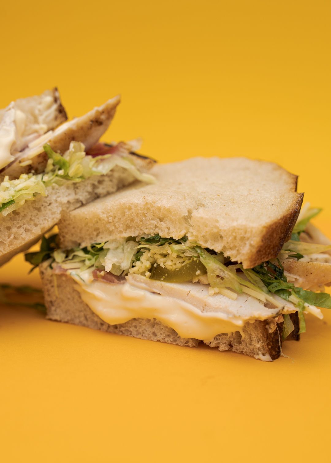 Emperor sandwich on a mustard yellow background