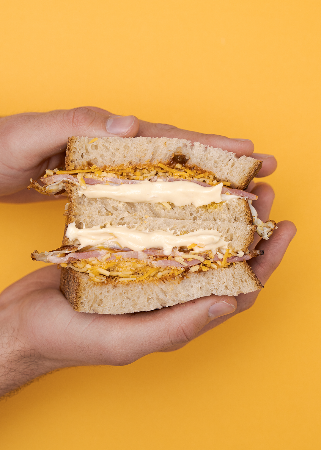 The morning mayo sandwich on a mustard yellow background