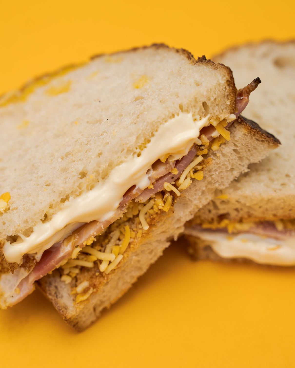 The morning mayo sandwich on a mustard yellow background