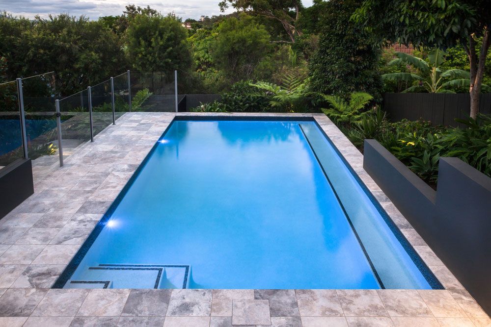 A Large Swimming Pool With Stairs Leading to It — Nabiac Water Carriers in Forster, NSW