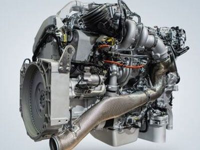 A close up of a diesel engine on a white background - Curry Truck & Auto