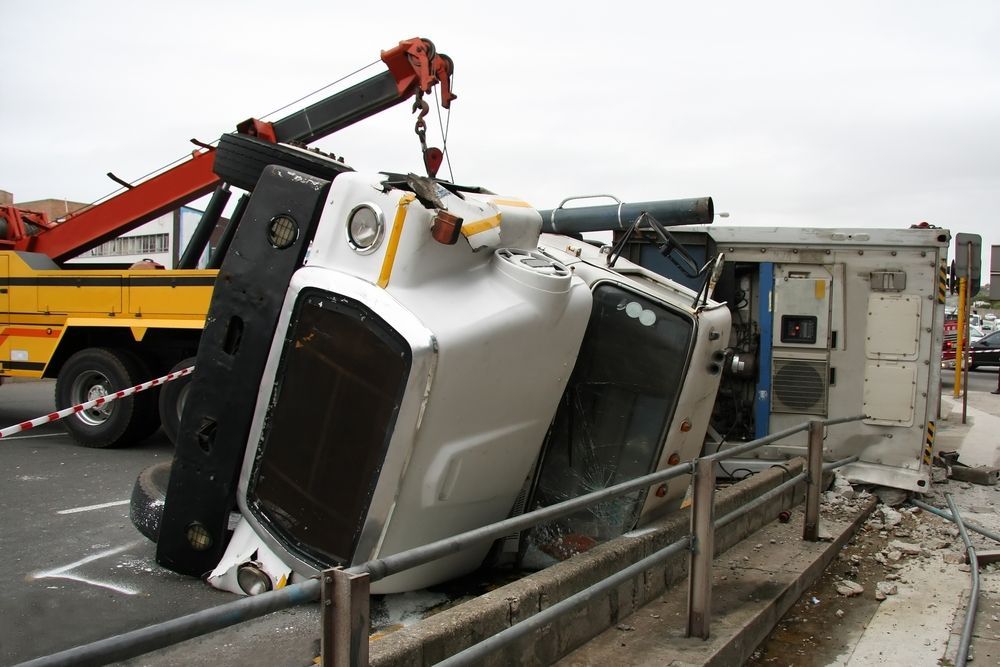 A White Truck Is Being Towed By A Yellow Tow Truck — Torquay & Anglesea Accident Towing Centre In Anglesea, VIC