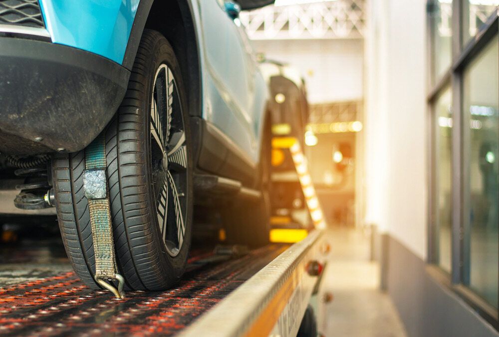 A Car Is Being Towed By A Tow Truck — Torquay & Anglesea Accident Towing Centre In Torquay, VIC