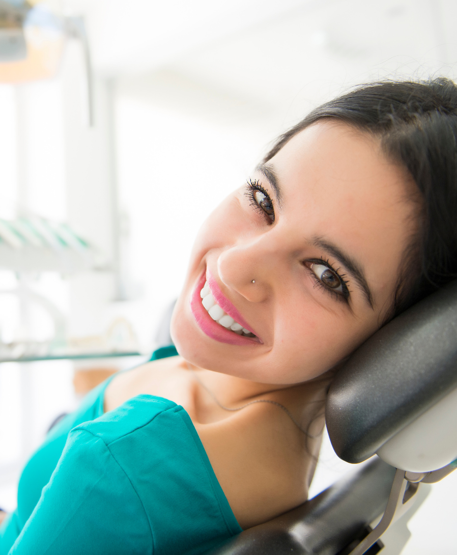Get sedation options to calm dental anxiety | Escondido CA Dentist PREVENTATIVE CARE | Sedation Dentist | Woman smiling in dental chair | Escondido CA dentist
