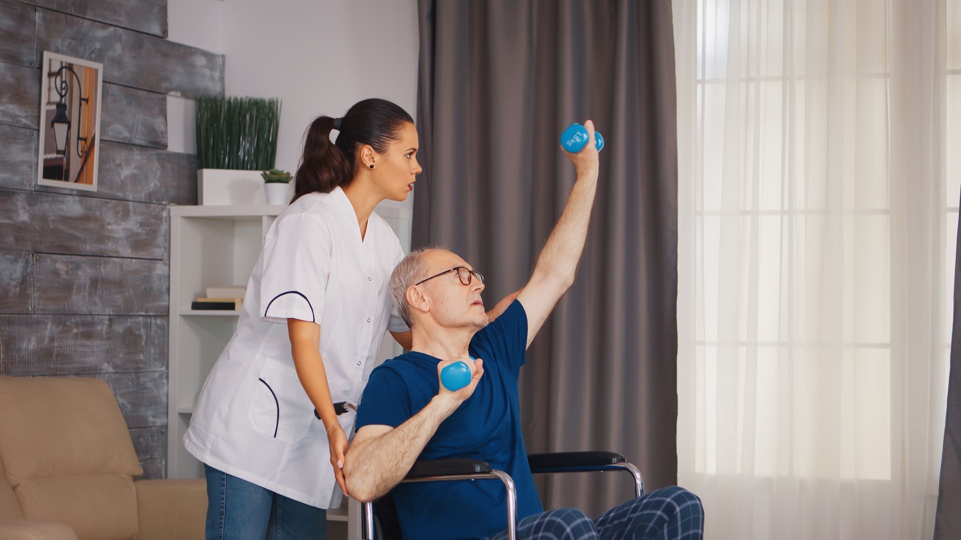 caregiver helping man recover from injury