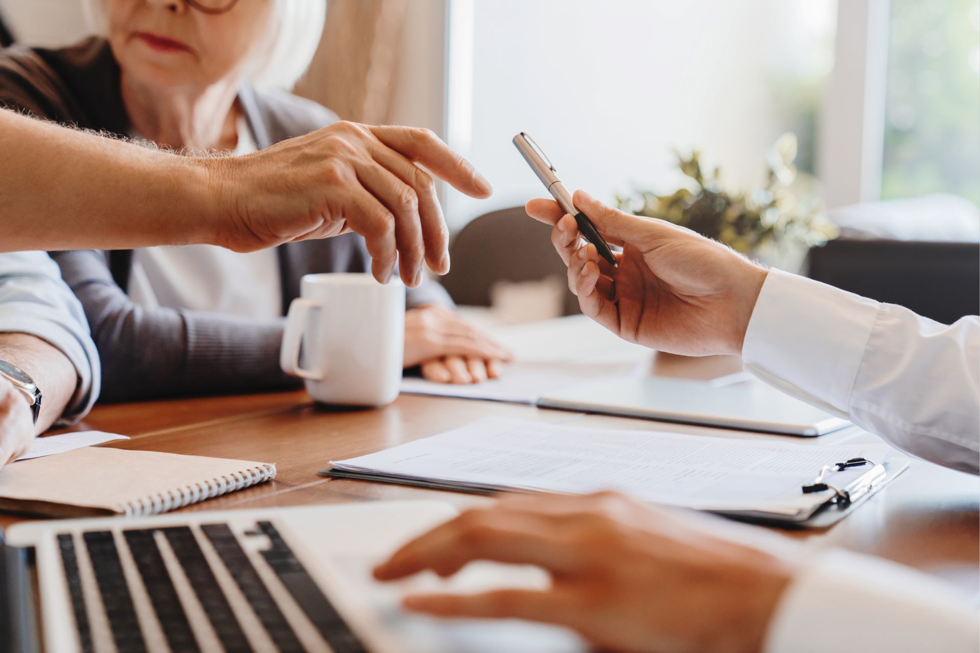 elderly couple signing legal documents
