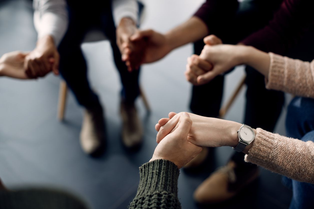 Holding hands during a support group session