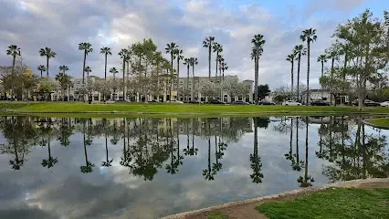 HWH San Diego Hard Money Lender - Real Estate showcases the waterfront charm of Chula Vista with landmarks like Marina View Park. The image highlights the scenic marina, peaceful walking paths, and panoramic views of San Diego Bay.
