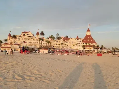 HWH San Diego Hard Money Lender - Real Estate highlights coastal living and real estate potential near Coronado Beach. The image showcases sandy shores, ocean waves, and scenic beachfront views that reflect the area’s relaxing and upscale lifestyle.