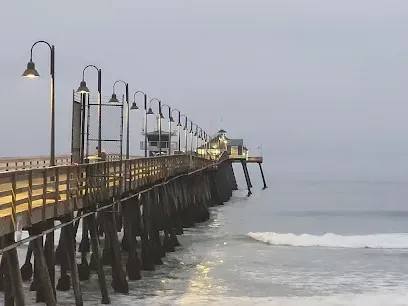HWH San Diego Hard Money Lender - Real Estate highlights coastal living and investment potential near the Imperial Beach Pier. The image showcases the long wooden pier extending into the Pacific Ocean, sandy beaches, and vibrant seaside activity that reflect the area’s relaxed lifestyle.