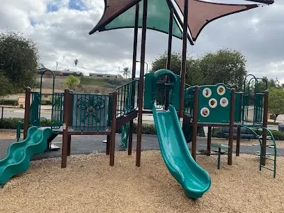 HWH San Diego Hard Money Lender - Real Estate emphasizes community living and investment potential near Jackson Park in La Mesa. The image features open green fields, playgrounds, and walking paths that showcase the neighborhood’s family-friendly and recreational lifestyle.