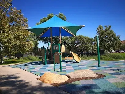 HWH San Diego Hard Money Lender - Real Estate highlights community recreation and investment potential near Poway Community Park. The image showcases open green fields, sports courts, playgrounds, and walking trails that reflect the area’s family-friendly and active lifestyle.