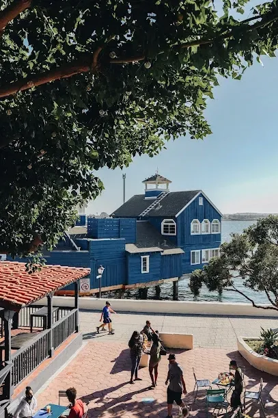 HWH San Diego Hard Money Lender - Real Estate showcases the coastal charm of San Diego with landmarks like Seaport Village. The image highlights the waterfront shops, dining spots, and scenic marina views that make this destination unique.