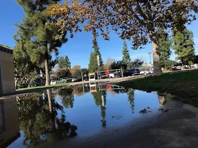 HWH San Diego Hard Money Lender - Real Estate highlights community and recreational appeal near Wells Park in El Cajon. The image showcases open green spaces, playgrounds, picnic areas, and walking paths that reflect the family-friendly and active lifestyle of the neighborhood.