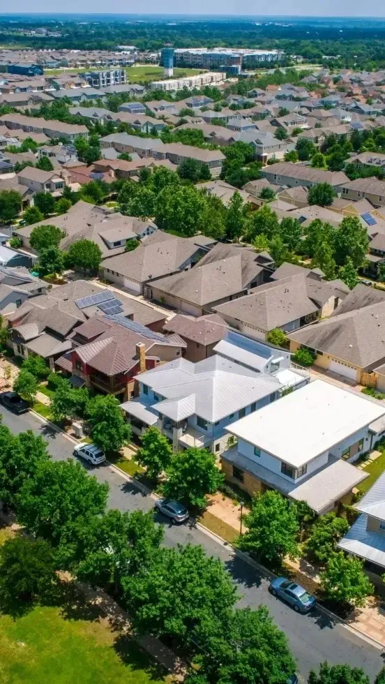 HWH San Diego Hard Money Lender - Real Estate shows a clear aerial view of houses on a sunny day, highlighting the beauty and structure of a thriving neighborhood.