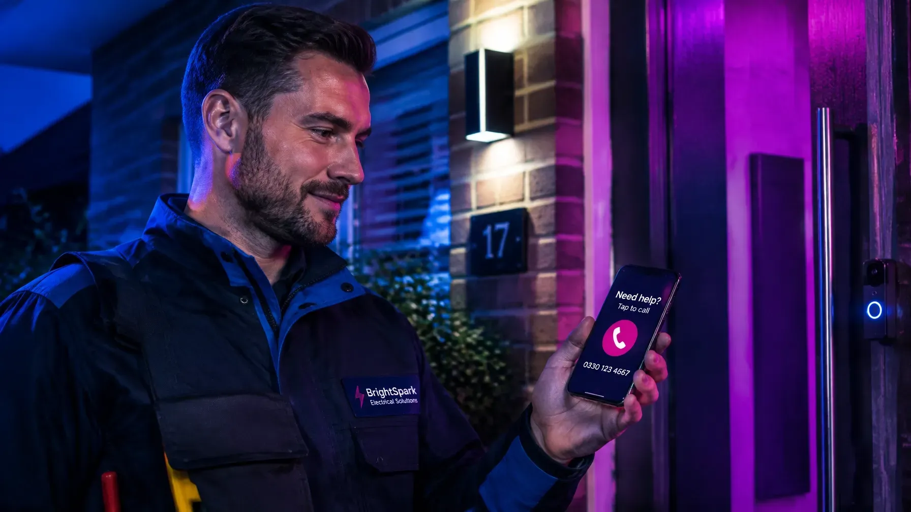 Electrician in work uniform checking a mobile service website with a clear tap-to-call option
