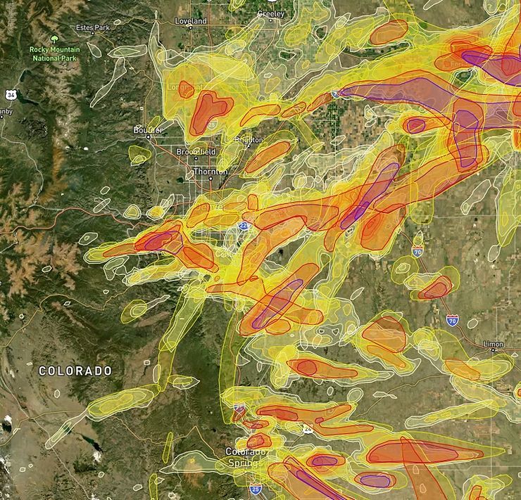Satellite map of Colorado with yellow, orange, and red weather radar bands over the state