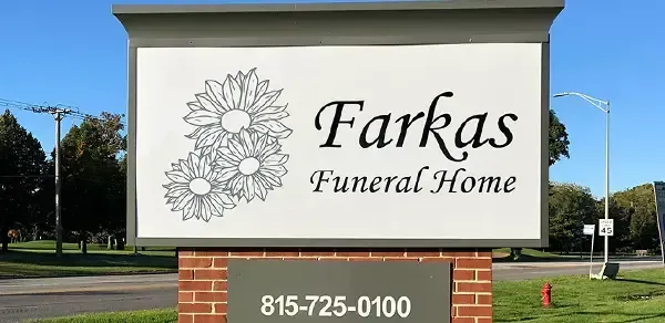 Farkas Funeral Home roadside sign with floral logo and phone number 815-725-0100