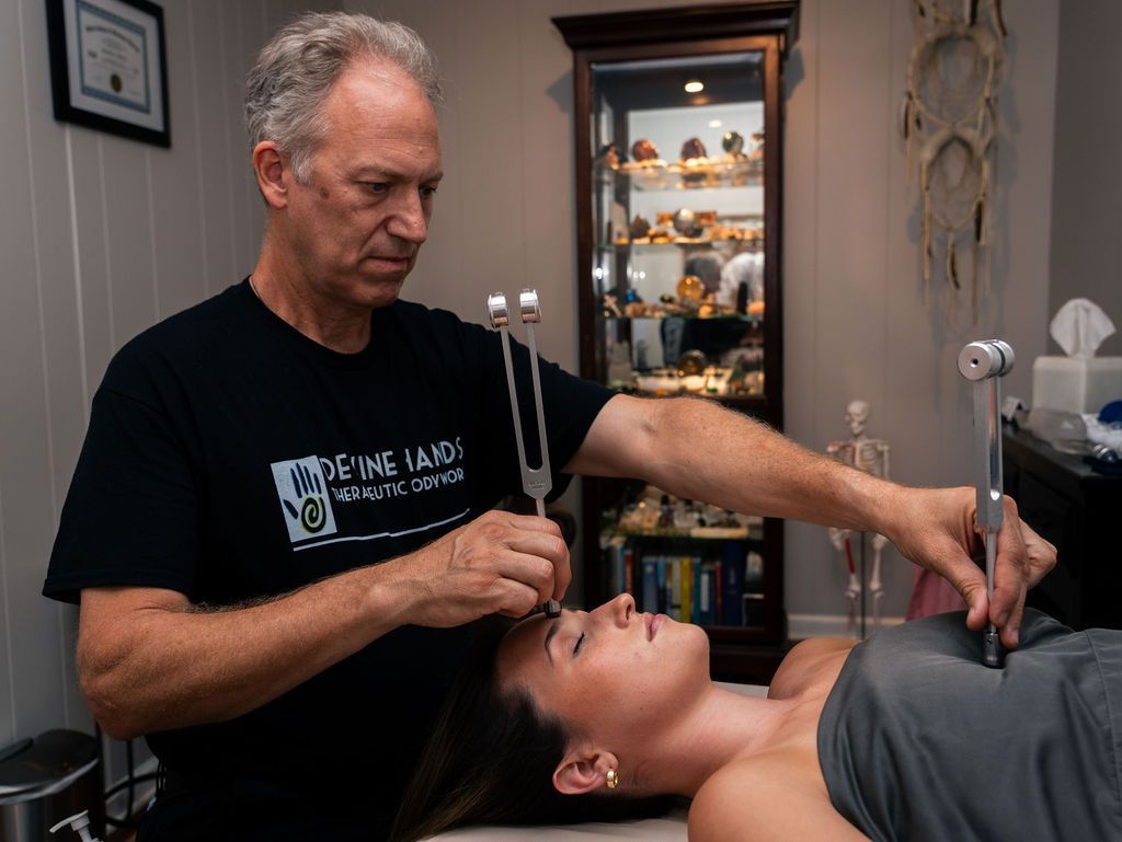 Practitioner adjusting a client’s face during a treatment in a spa room