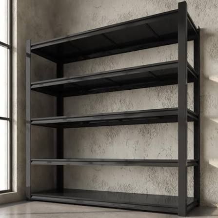 Black metal shelving unit against a gray wall in a corner near a window