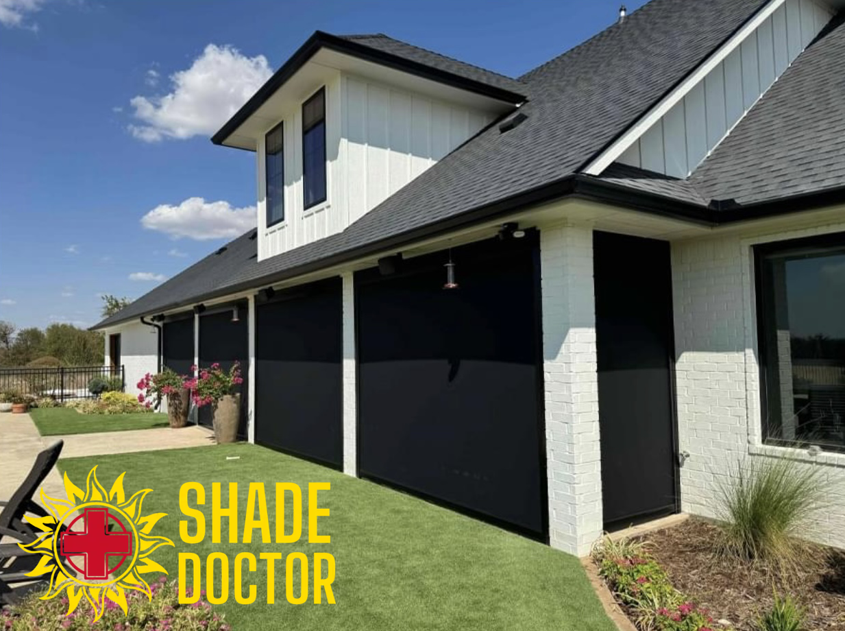 Modern house with black roller shutters and Shade Doctor logo in the corner