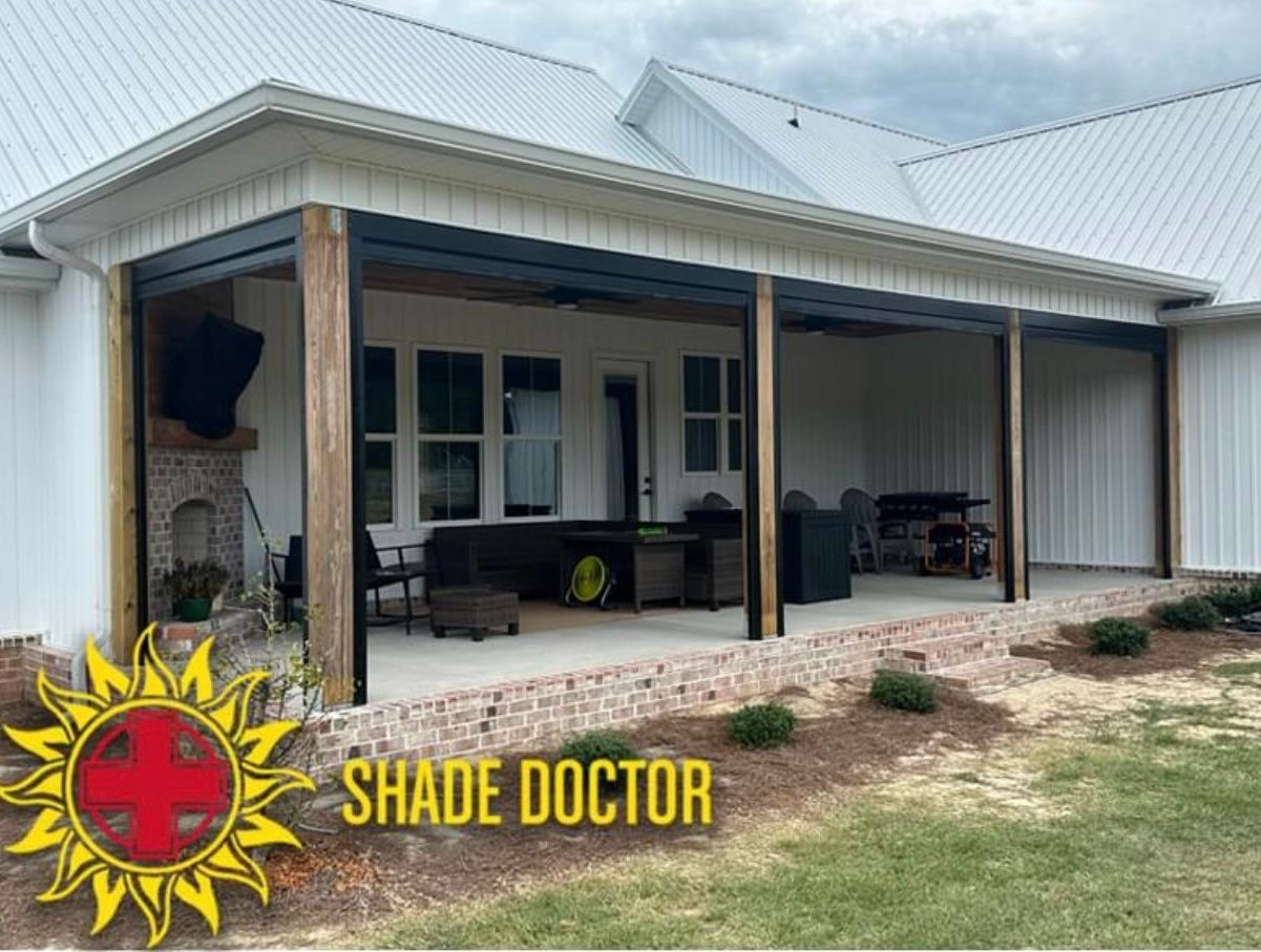 Covered patio with ceiling fan and outdoor seating, featuring Shade Doctor branding on the lower left.