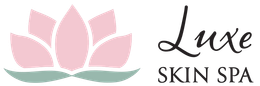 The logo for luxe skin spa has a pink lotus flower on it.