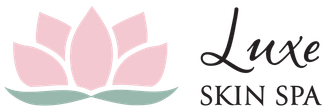 The logo for luxe skin spa has a pink lotus flower on it.