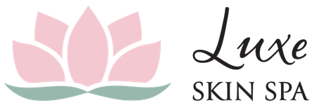 The logo for luxe skin spa has a pink lotus flower on it.