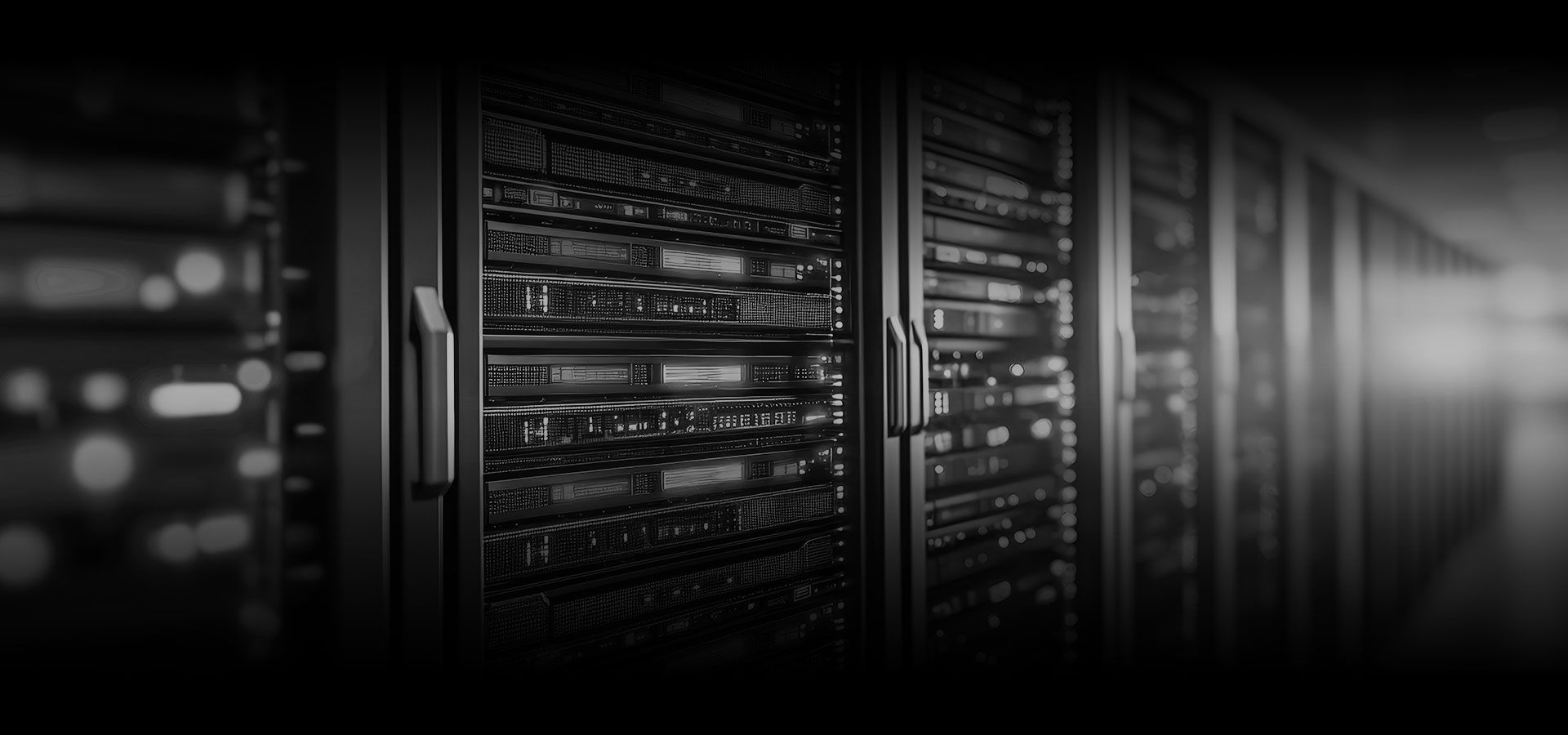 Rows of server racks in a dim data center, lit by bright light from the right side.
