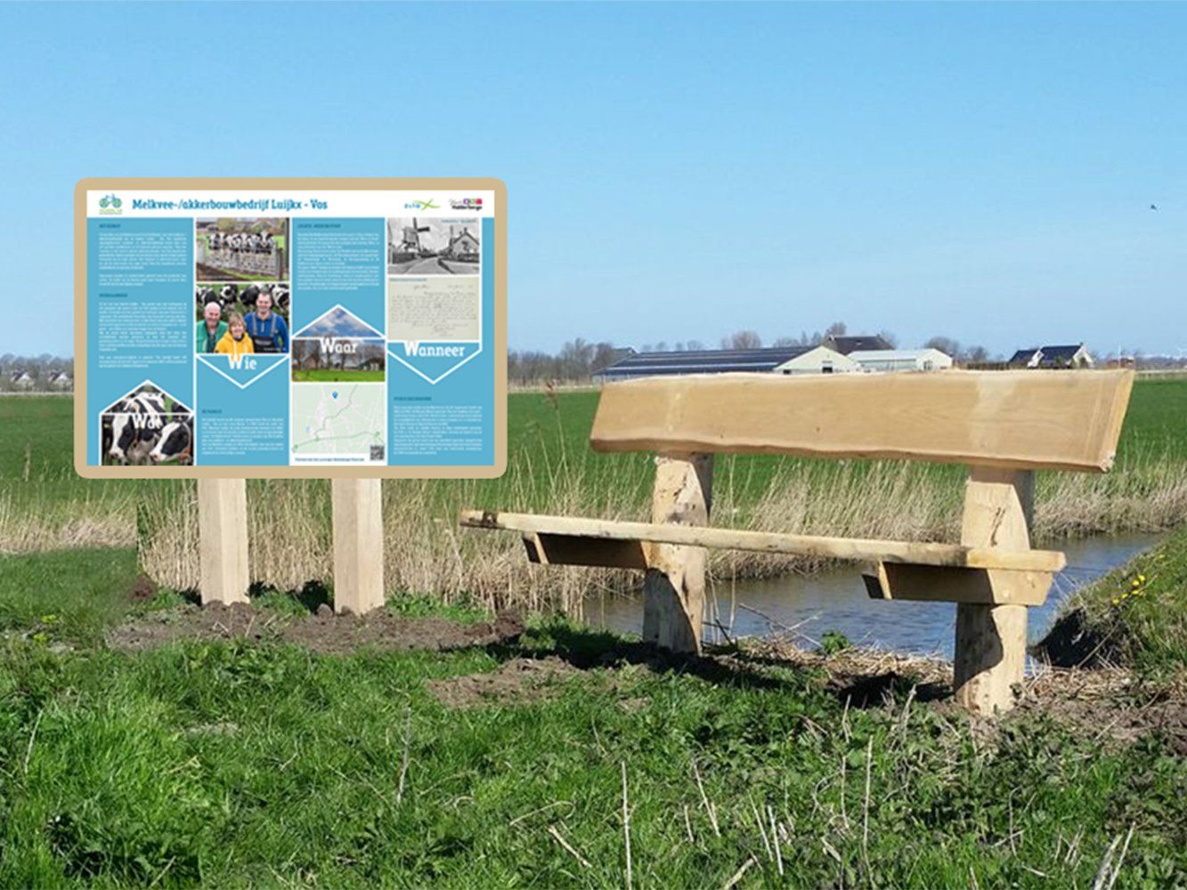 Een houten bank staat in een grasveld naast een bord.