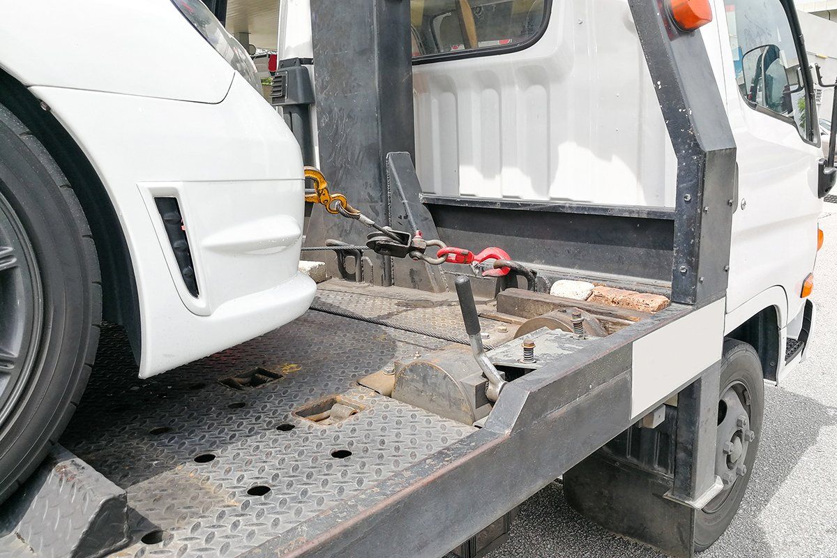 broken down auto vehicle car towed