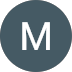 White “M” on a dark gray circular icon.